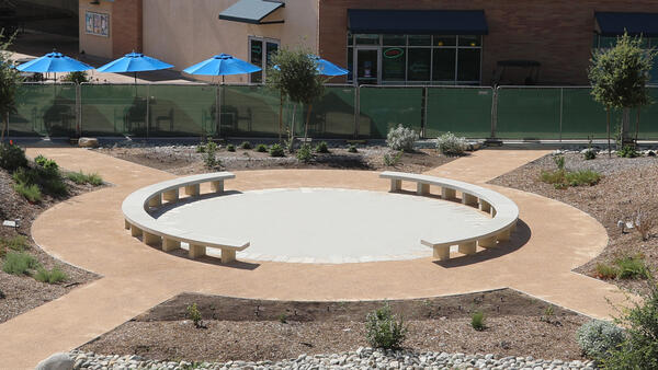 Round pathway with drought-tolerant plants around it