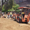 Landscapers leveling the ground