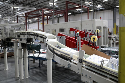 Multifold towels on an assembly line