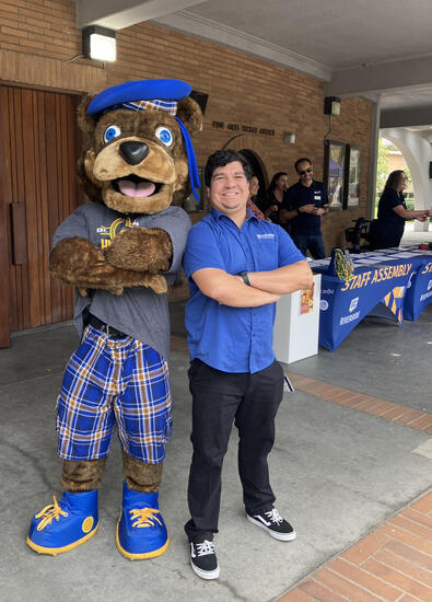 Scotty the bear poses with Hondo at an event